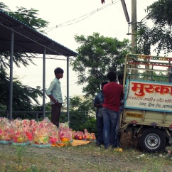 Loading the ready Ganesh statues into the truck.