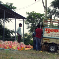 Loading the ready Ganesh statues into the truck.